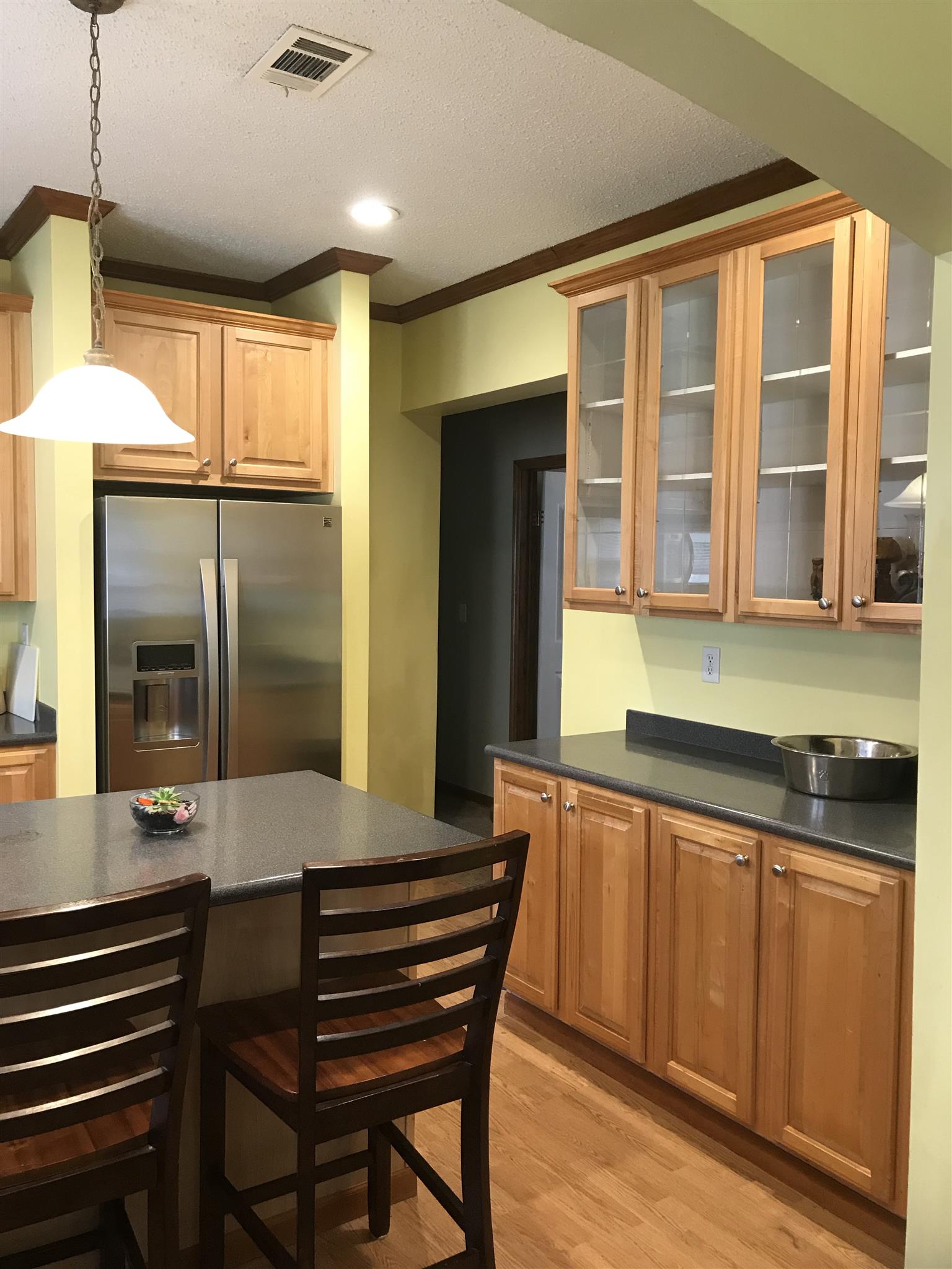 1237 Fowler Ford Road Portland, TN 37148 - Photo 8 of 17 a kitchen with stainless steel appliances granite countertop a sink and a refrigerator