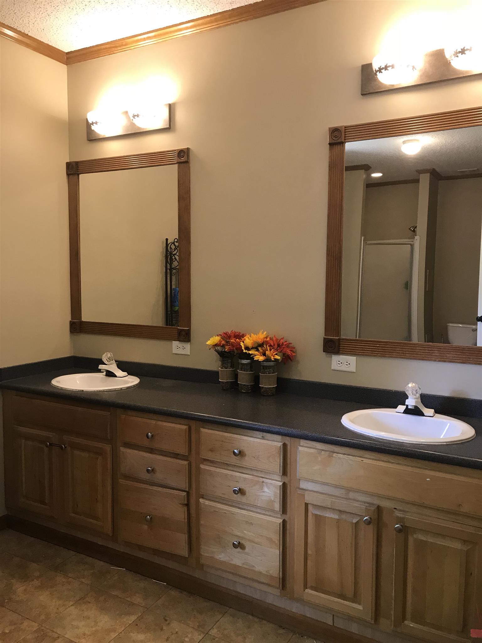 1237 Fowler Ford Road Portland, TN 37148 - Photo 10 of 17 a bathroom with a granite countertop sink and a mirror