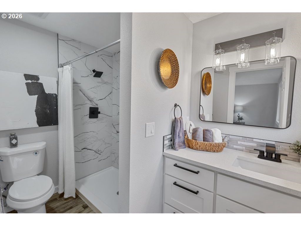 2868 Southwest 196th Avenue Beaverton, OR 97003 - Photo 11 of 34 a bathroom with a toilet sink and mirror