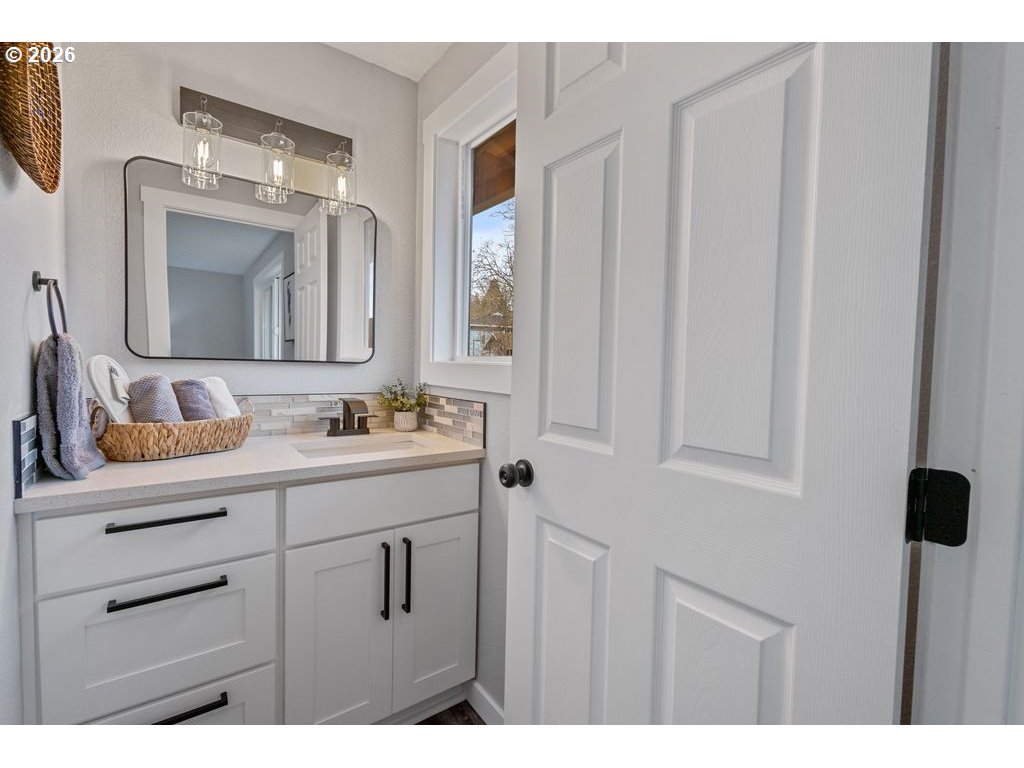 2868 Southwest 196th Avenue Beaverton, OR 97003 - Photo 12 of 34 a bathroom with a double vanity sink and mirror