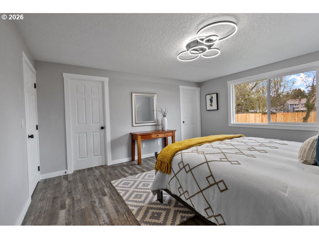 2868 Southwest 196th Avenue Beaverton, OR 97003 - Photo 16 of 34 a bedroom with a bed and a chandelier