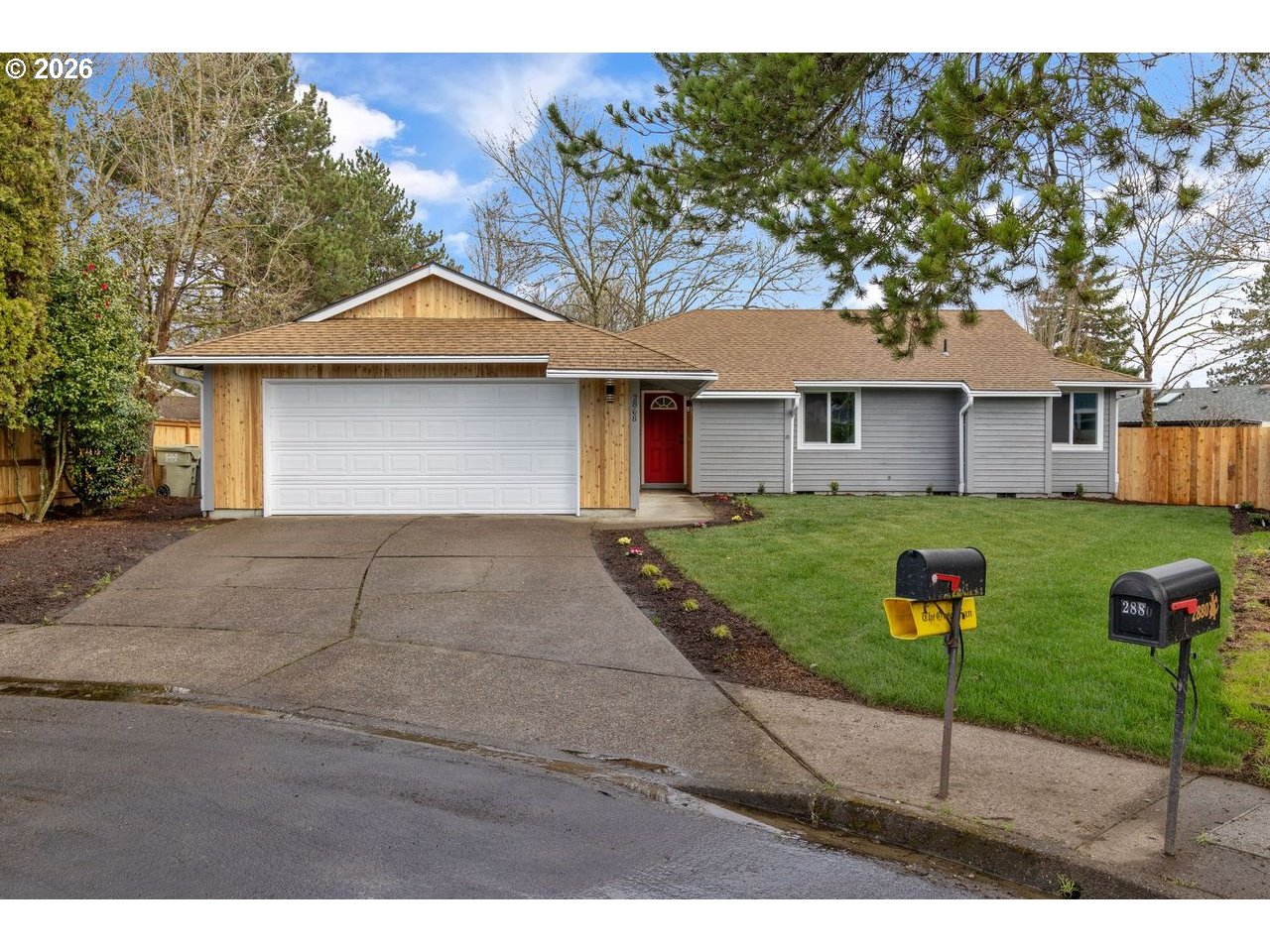 2868 Southwest 196th Avenue Beaverton, OR 97003 - Photo 2 of 34 a house that has a tree in front of it