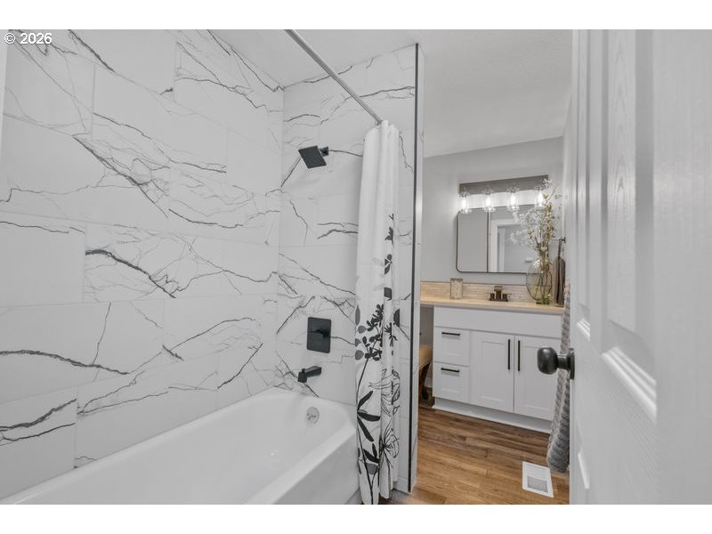 2868 Southwest 196th Avenue Beaverton, OR 97003 - Photo 22 of 34 a bathroom with a bathtub and a sink