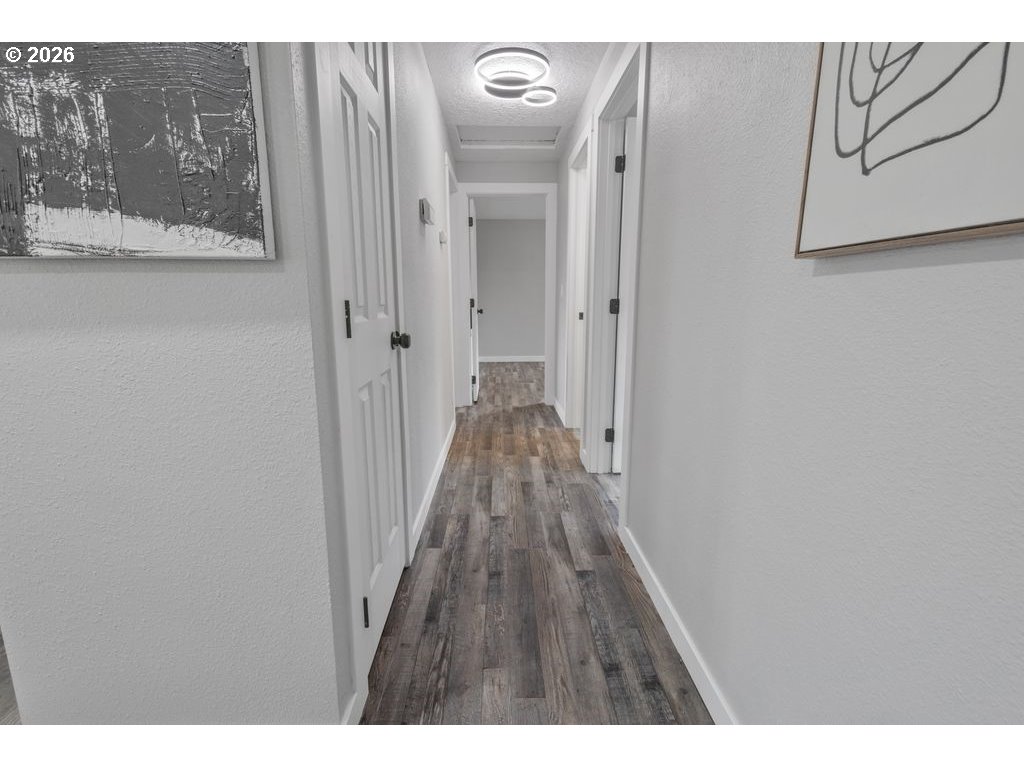 2868 Southwest 196th Avenue Beaverton, OR 97003 - Photo 9 of 34 a view of a hallway with wooden floor
