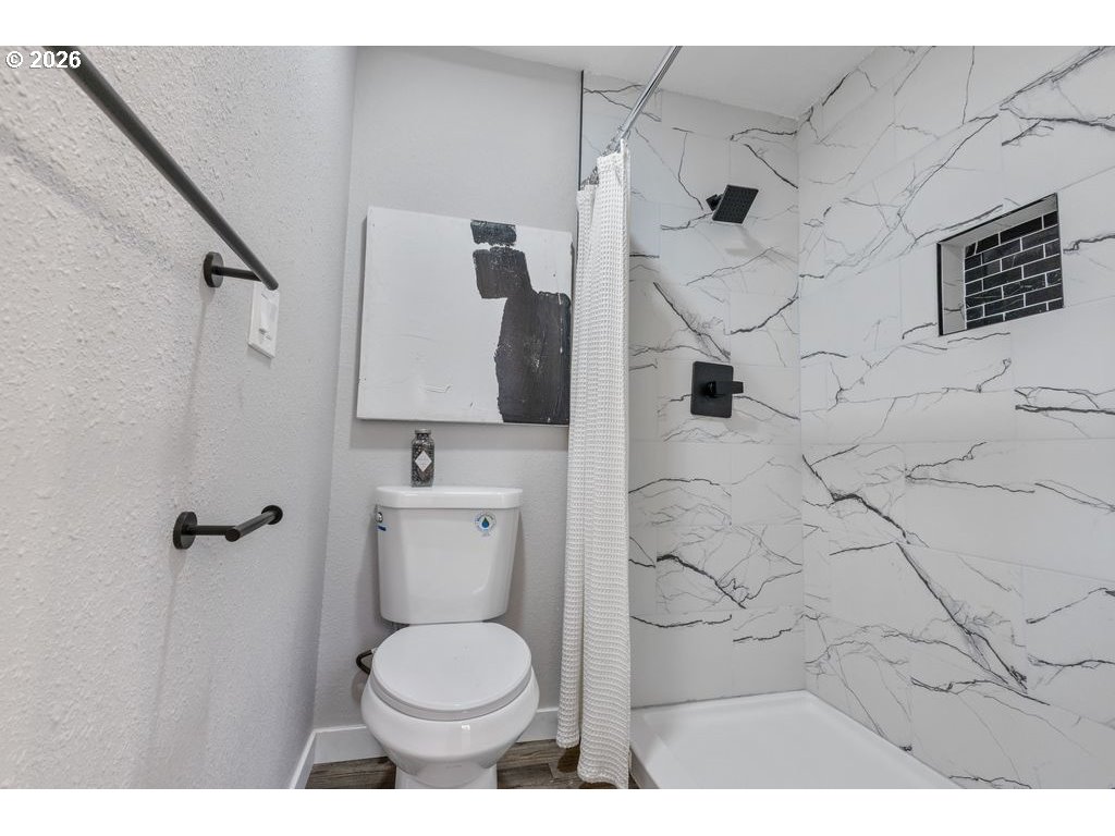 2868 Southwest 196th Avenue Beaverton, OR 97003 - Photo 10 of 34 a bathroom with a toilet and a shower