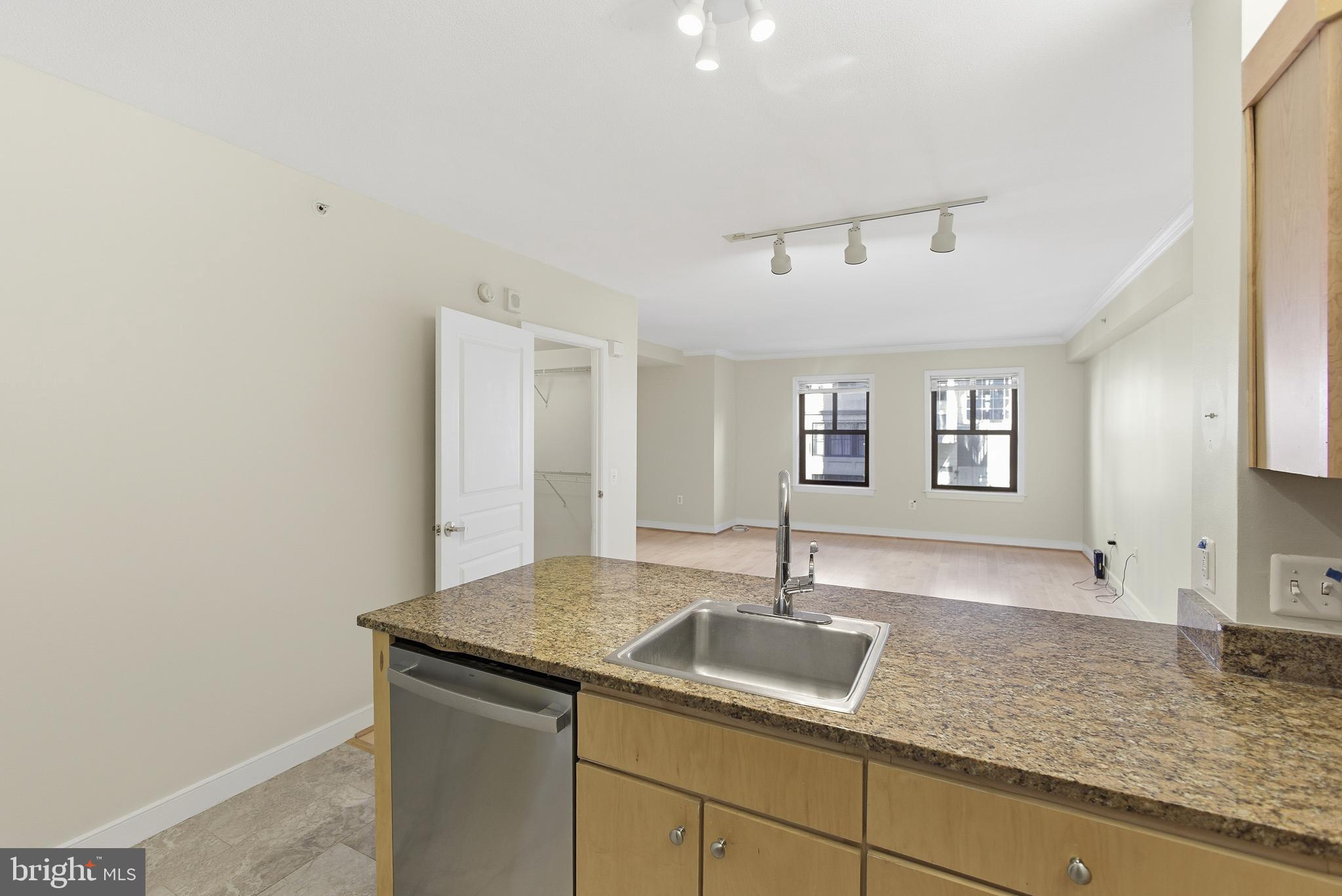 616 E Street Northwest, Unit 419 Washington, DC 20004 - Photo 12 of 30 a kitchen with a sink and cabinets