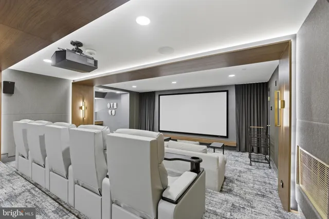 a living room with couches and painted walls