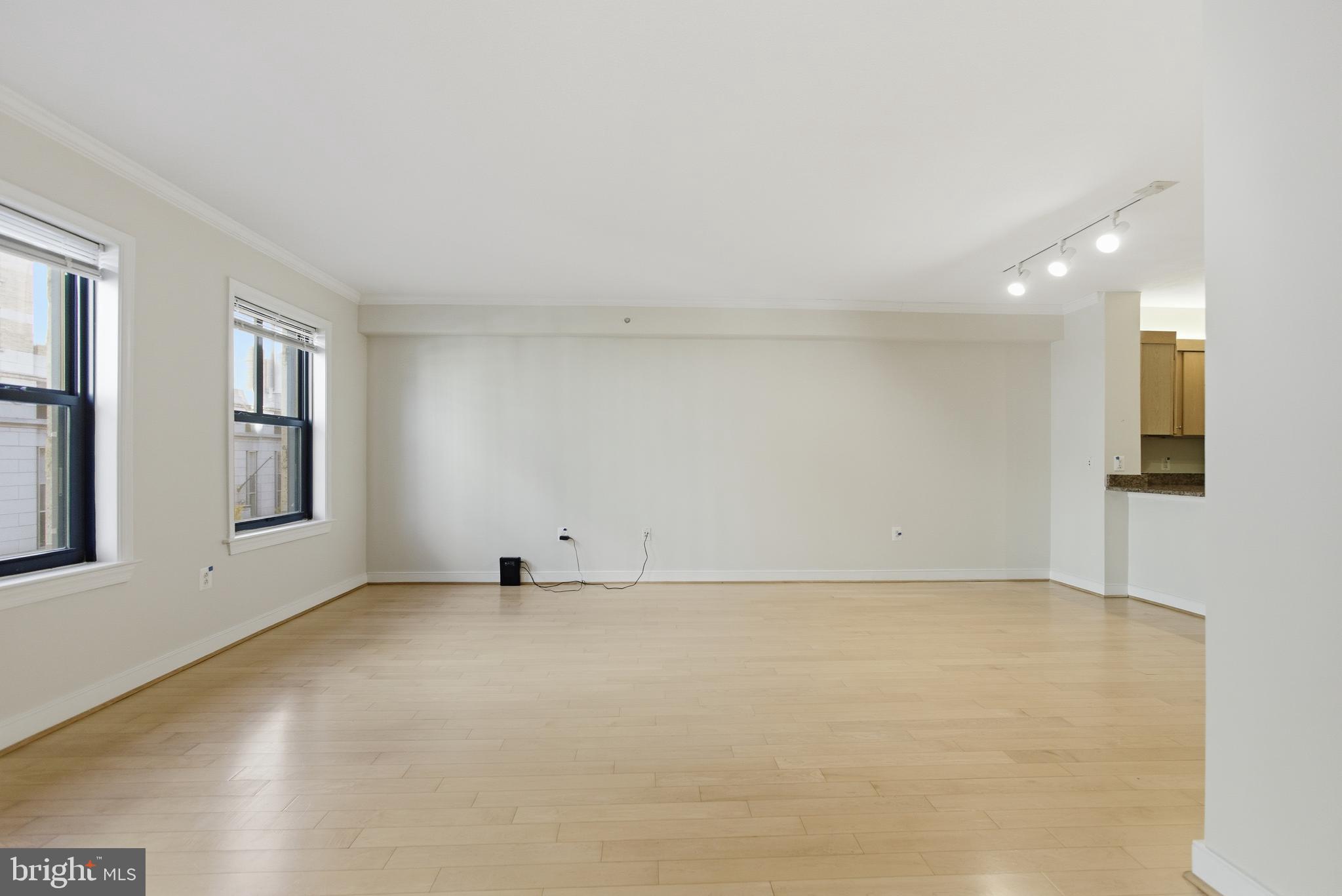 616 E Street Northwest, Unit 419 Washington, DC 20004 - Photo 2 of 30 an empty room with windows