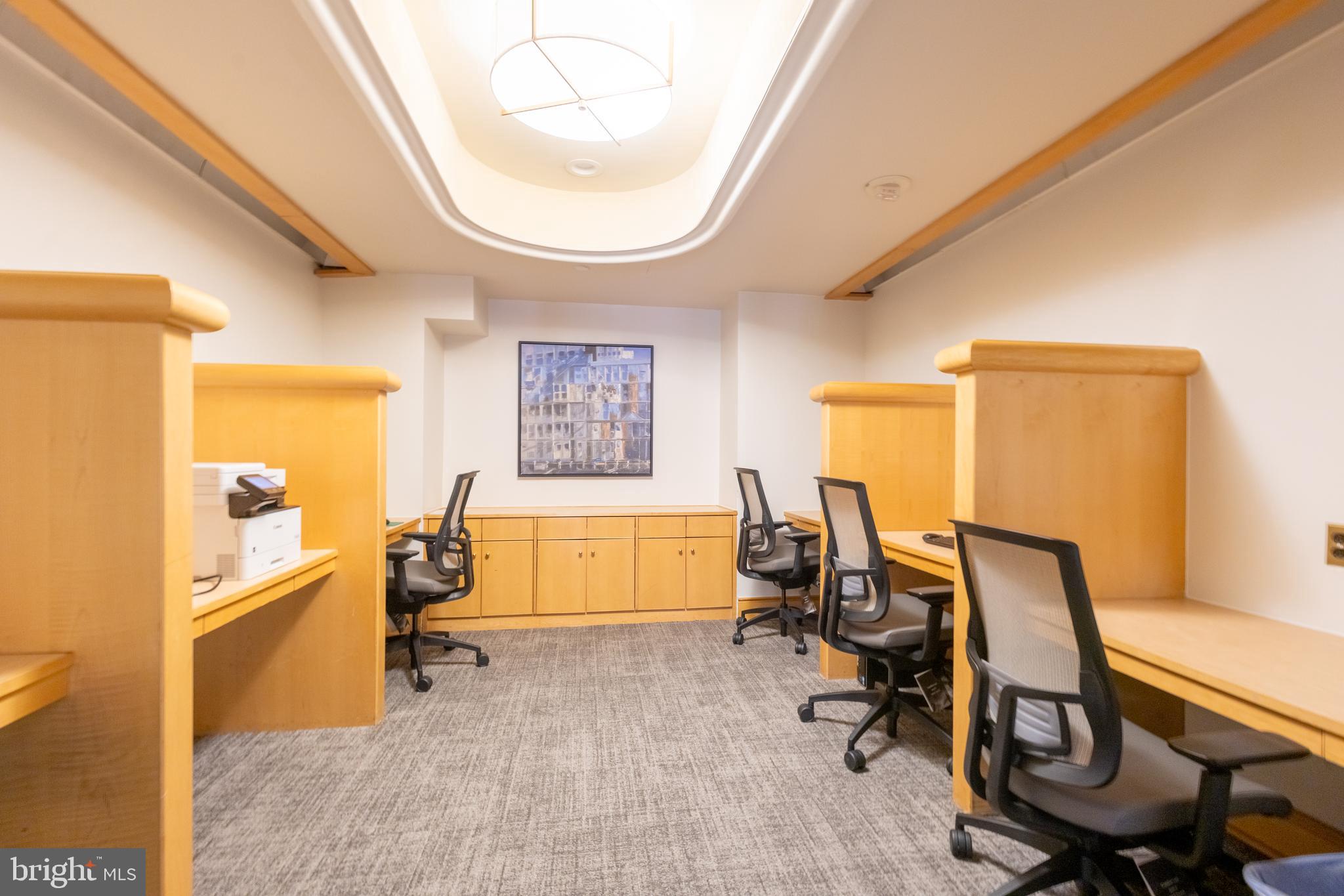 616 E Street Northwest, Unit 419 Washington, DC 20004 - Photo 25 of 30 a view of a workspace with furniture and a window