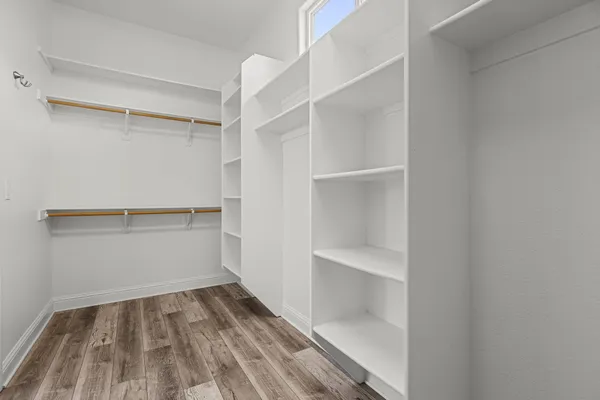 a view of an empty walk in closet
