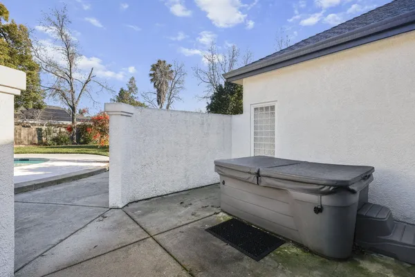 a view of a patio with table and chairs and potted plants