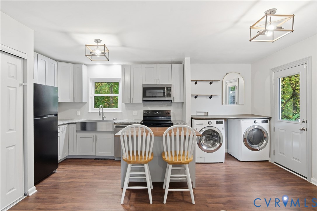 1802 Freeman Street Hopewell, VA 23860 - Photo 6 of 20 a kitchen that has a table chairs appliances and cabinets