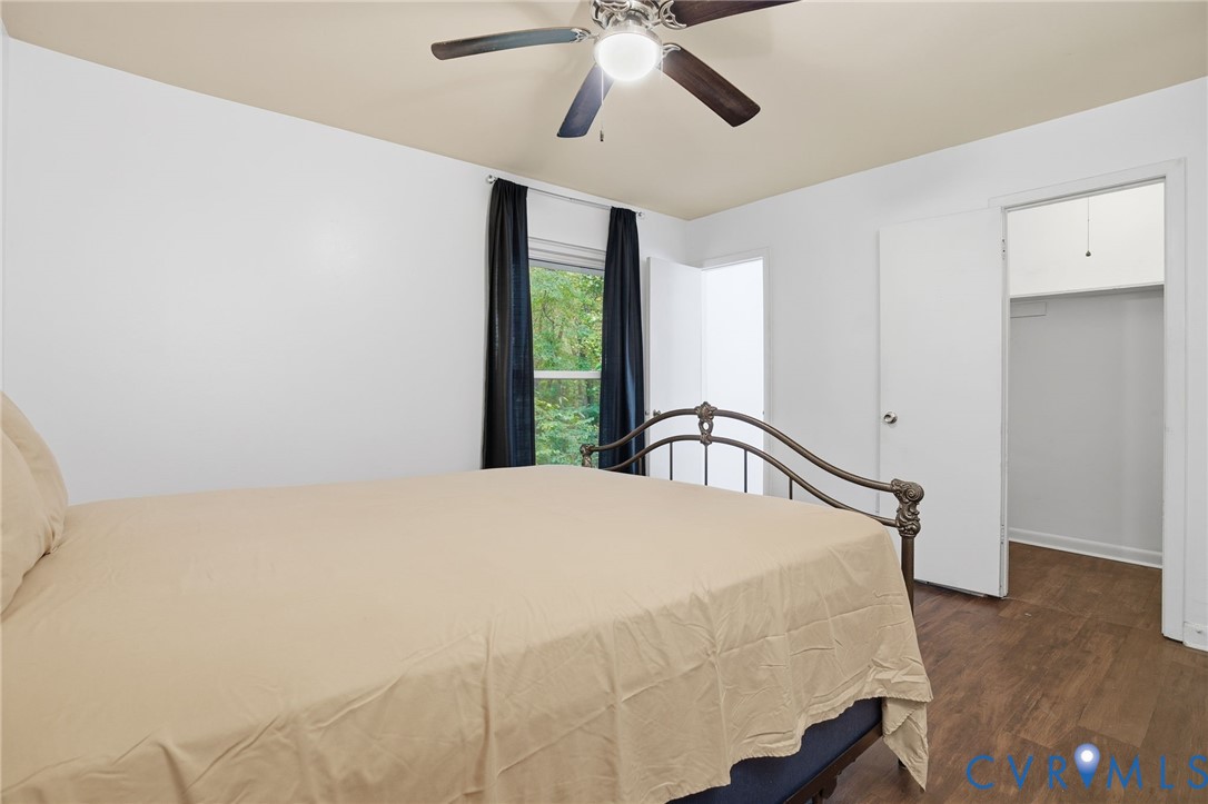 1802 Freeman Street Hopewell, VA 23860 - Photo 10 of 20 a bedroom with a bed and a chandelier