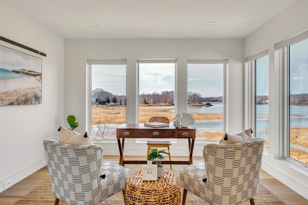 10 Chestnut Place Hingham, MA 02043 - Photo 11 of 32 a living room with furniture and floor to ceiling windows