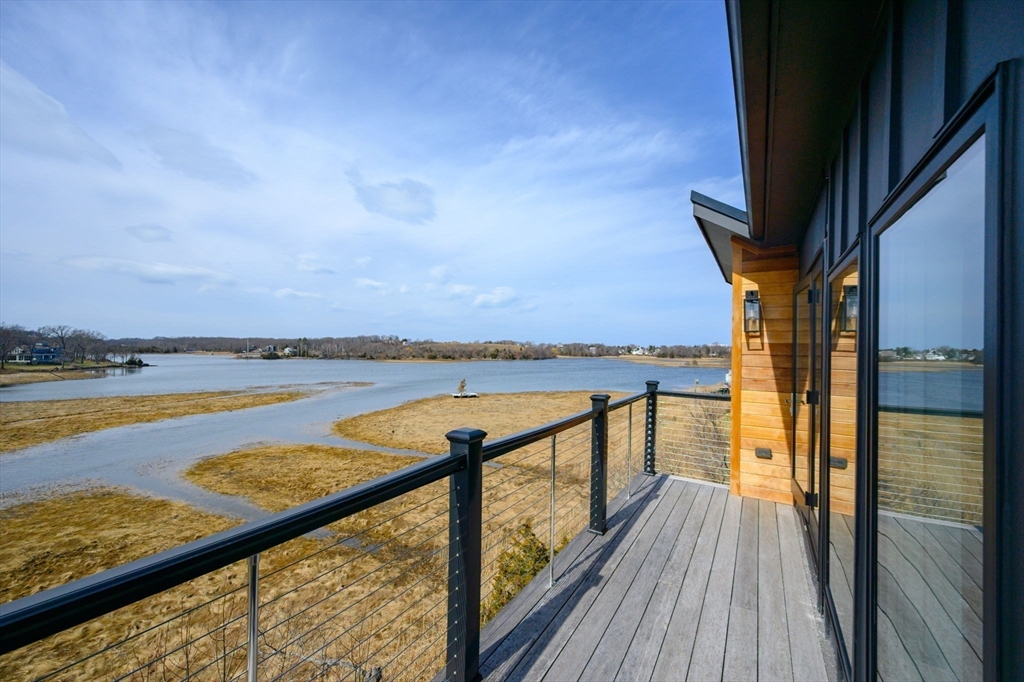 10 Chestnut Place Hingham, MA 02043 - Photo 18 of 32 a balcony with an ocean view