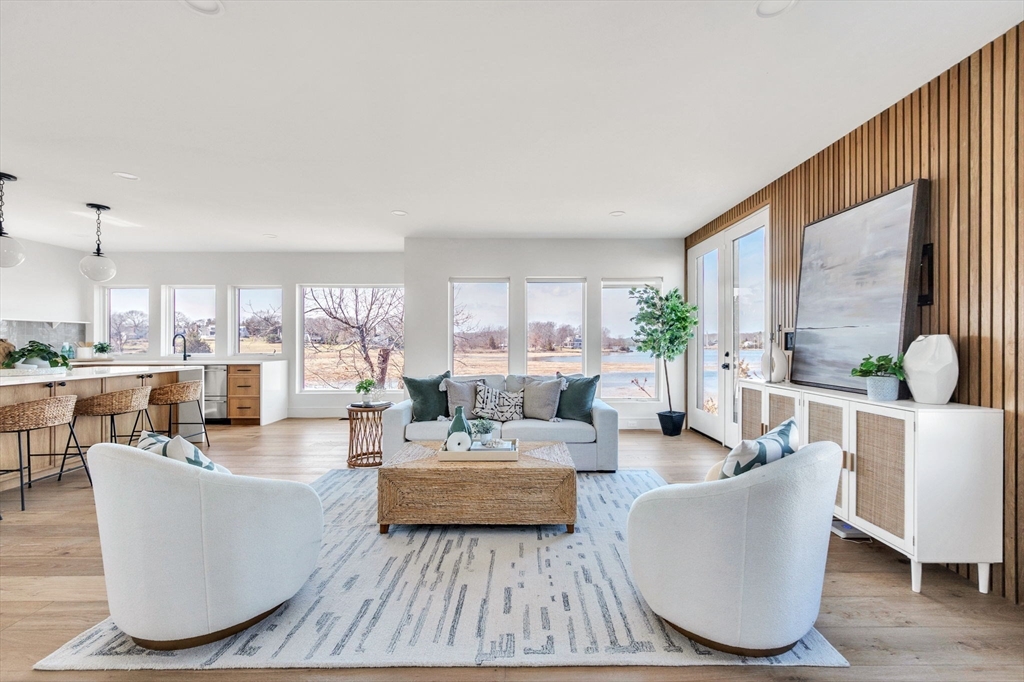 10 Chestnut Place Hingham, MA 02043 - Photo 2 of 32 a living room with fireplace furniture and a large window