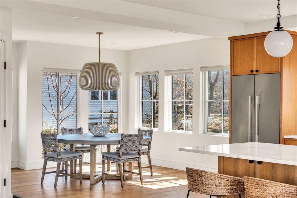 10 Chestnut Place Hingham, MA 02043 - Photo 8 of 32 a view of a dining room with furniture window and wooden floor