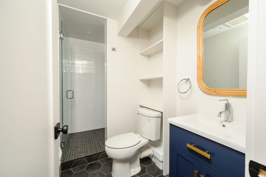10 Chestnut Place Hingham, MA 02043 - Photo 9 of 32 a bathroom with a sink toilet and shower