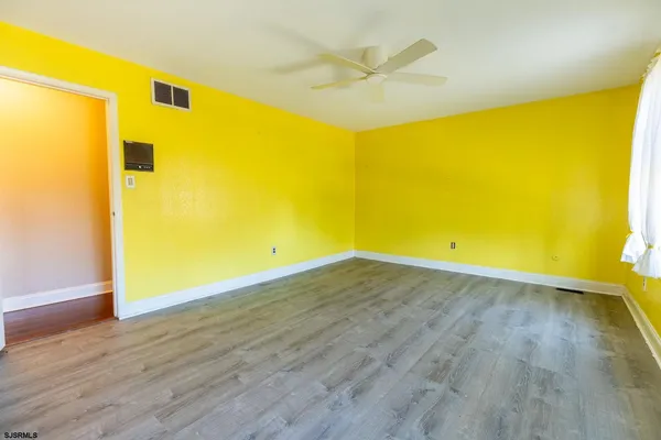 a view of a big room with wooden floor