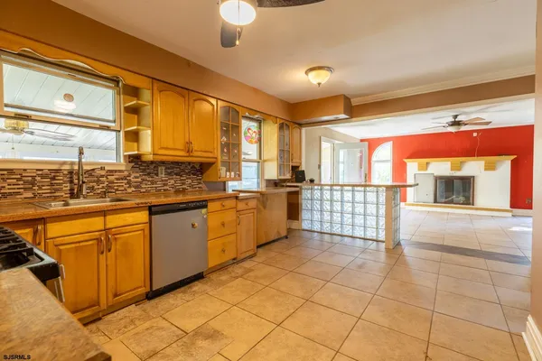 a kitchen with stainless steel appliances granite countertop a stove and cabinets
