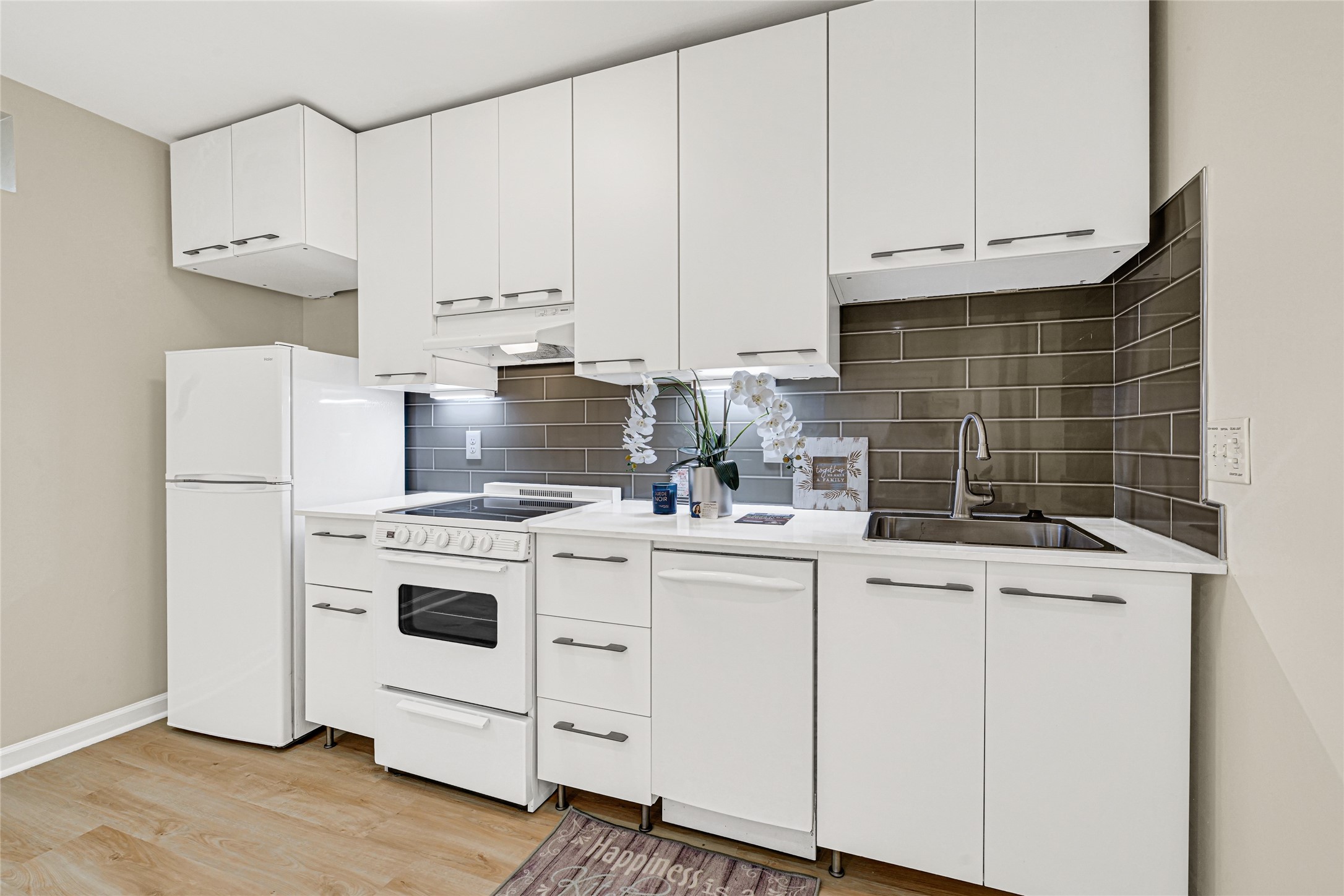 1603 Welch Street, Unit 8 Houston, TX 77006 - Photo 14 of 21 a kitchen with appliances a sink and cabinets