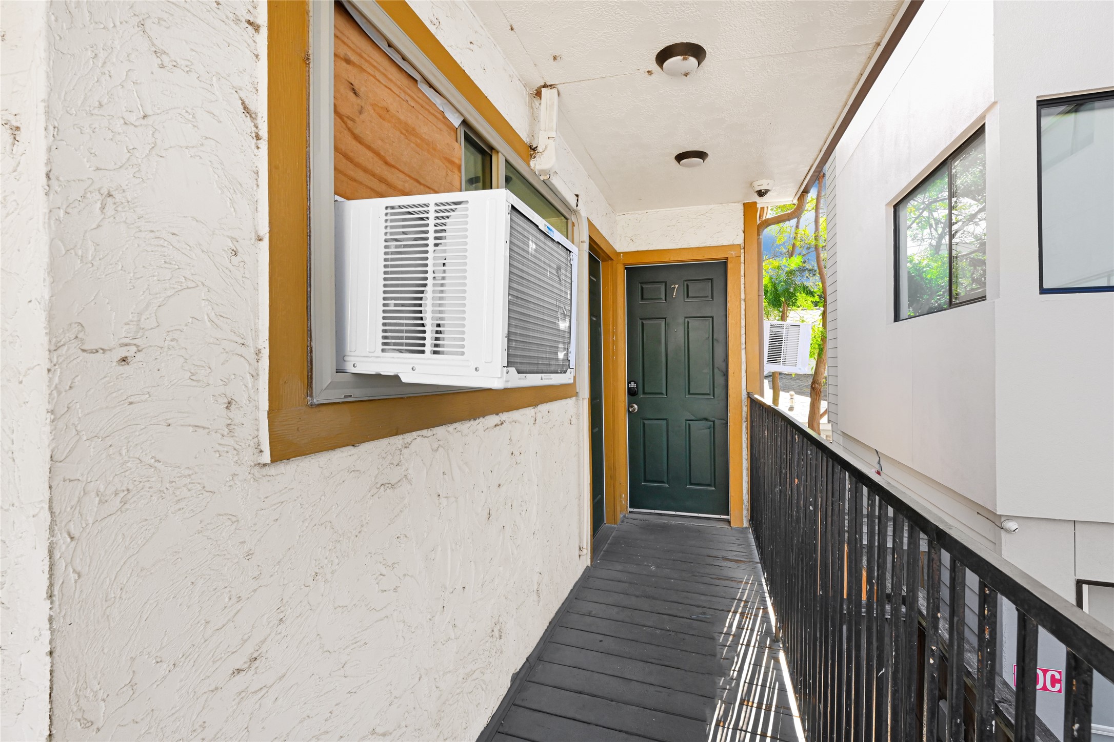 1603 Welch Street, Unit 8 Houston, TX 77006 - Photo 9 of 21 a view of a hallway with wooden floor and staircase
