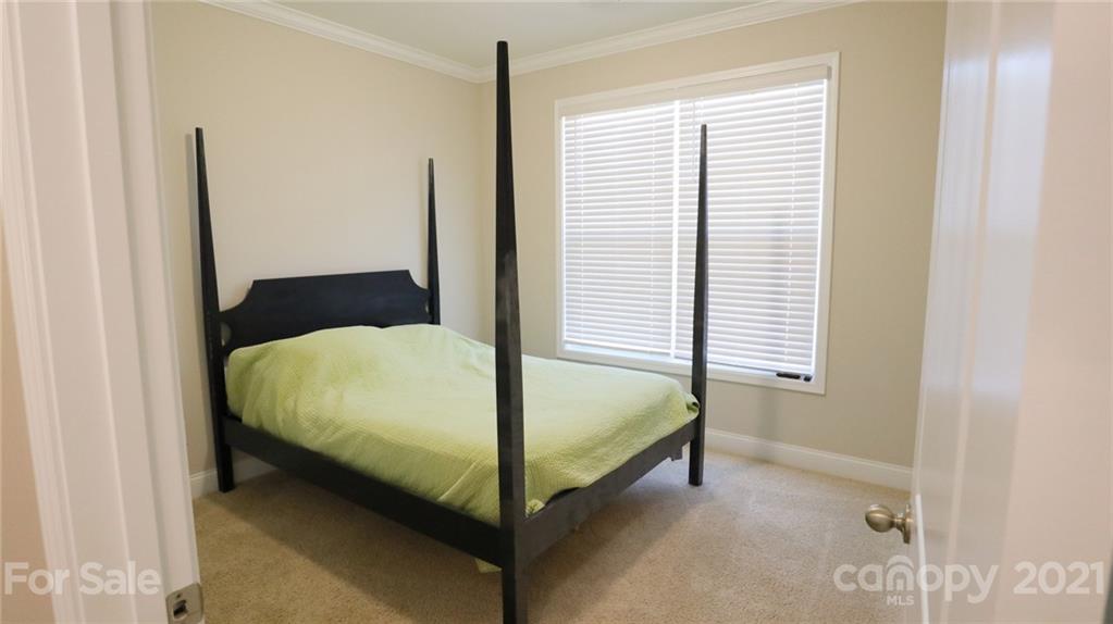 1437 Bramblewood Drive Fort Mill, SC 29708 - Photo 11 of 22 a bed sitting in a bedroom next to a window