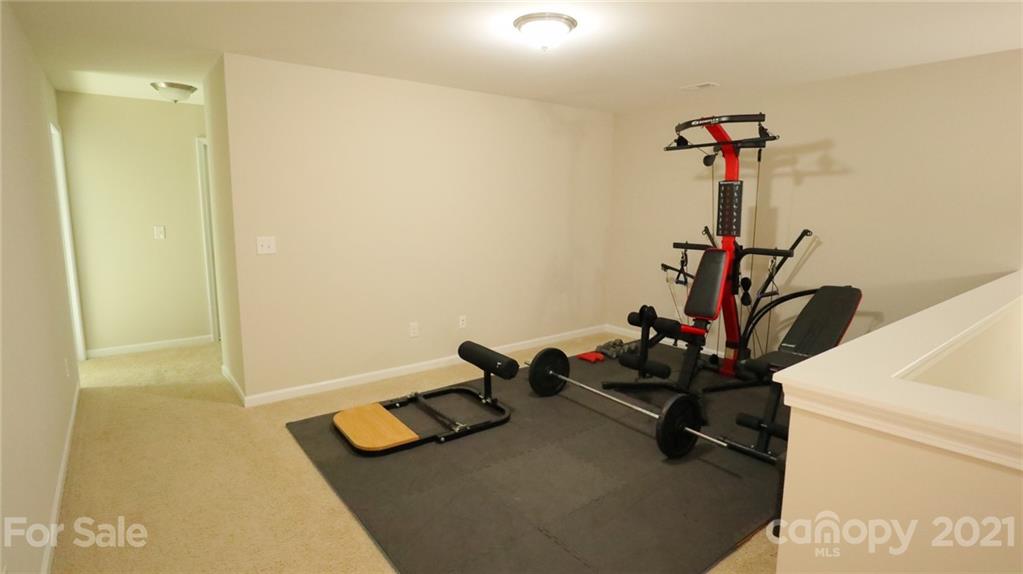 1437 Bramblewood Drive Fort Mill, SC 29708 - Photo 13 of 22 a room with gym equipment