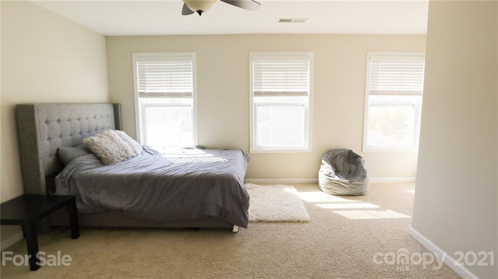 1437 Bramblewood Drive Fort Mill, SC 29708 - Photo 21 of 22 a bedroom with a bed and a window
