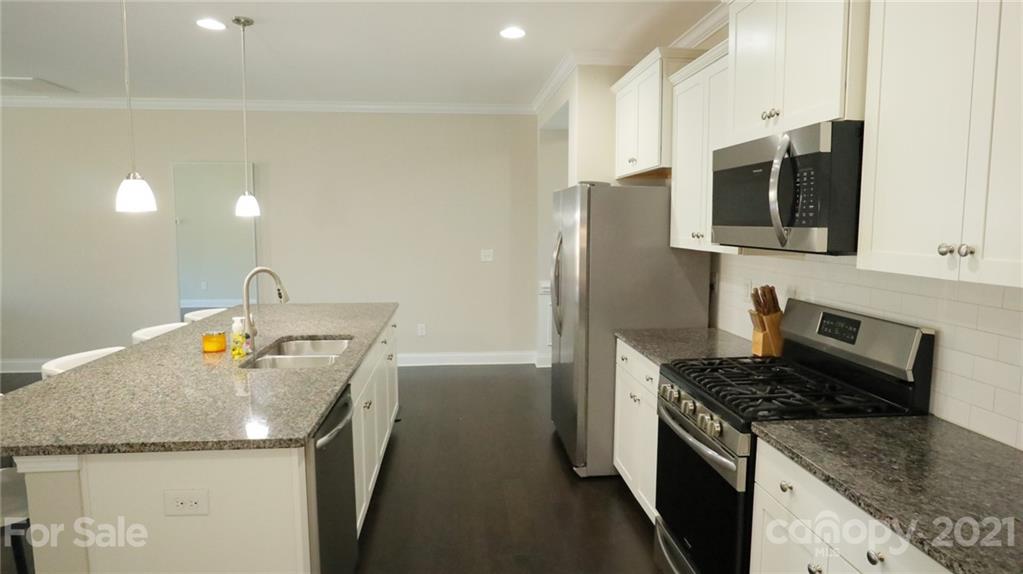1437 Bramblewood Drive Fort Mill, SC 29708 - Photo 5 of 22 a kitchen that has a sink and a stove