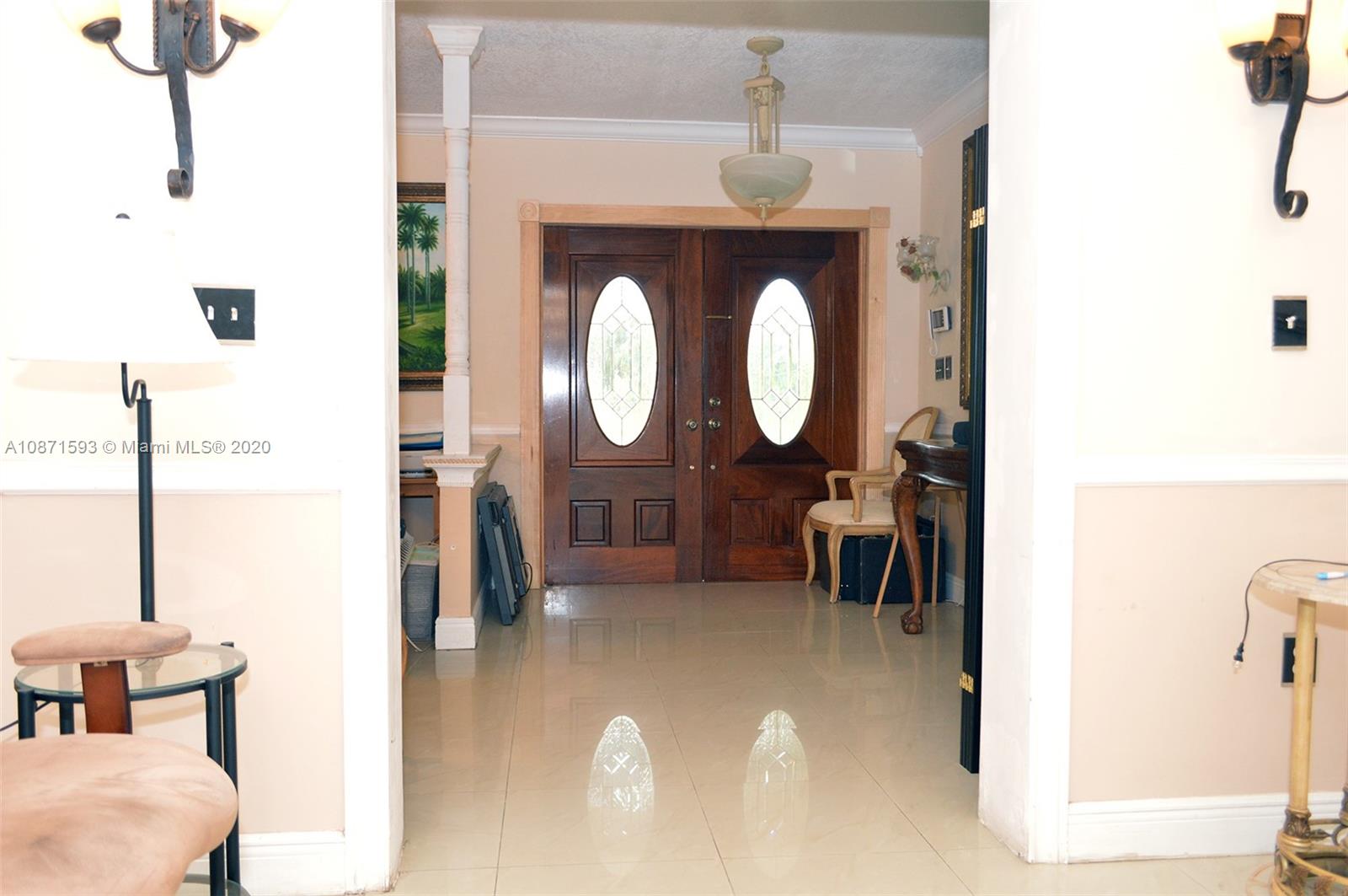 6500 Southwest 148th Avenue Southwest Ranches, FL 33330 - Photo 11 of 25 a view of living room with furniture and a mirror