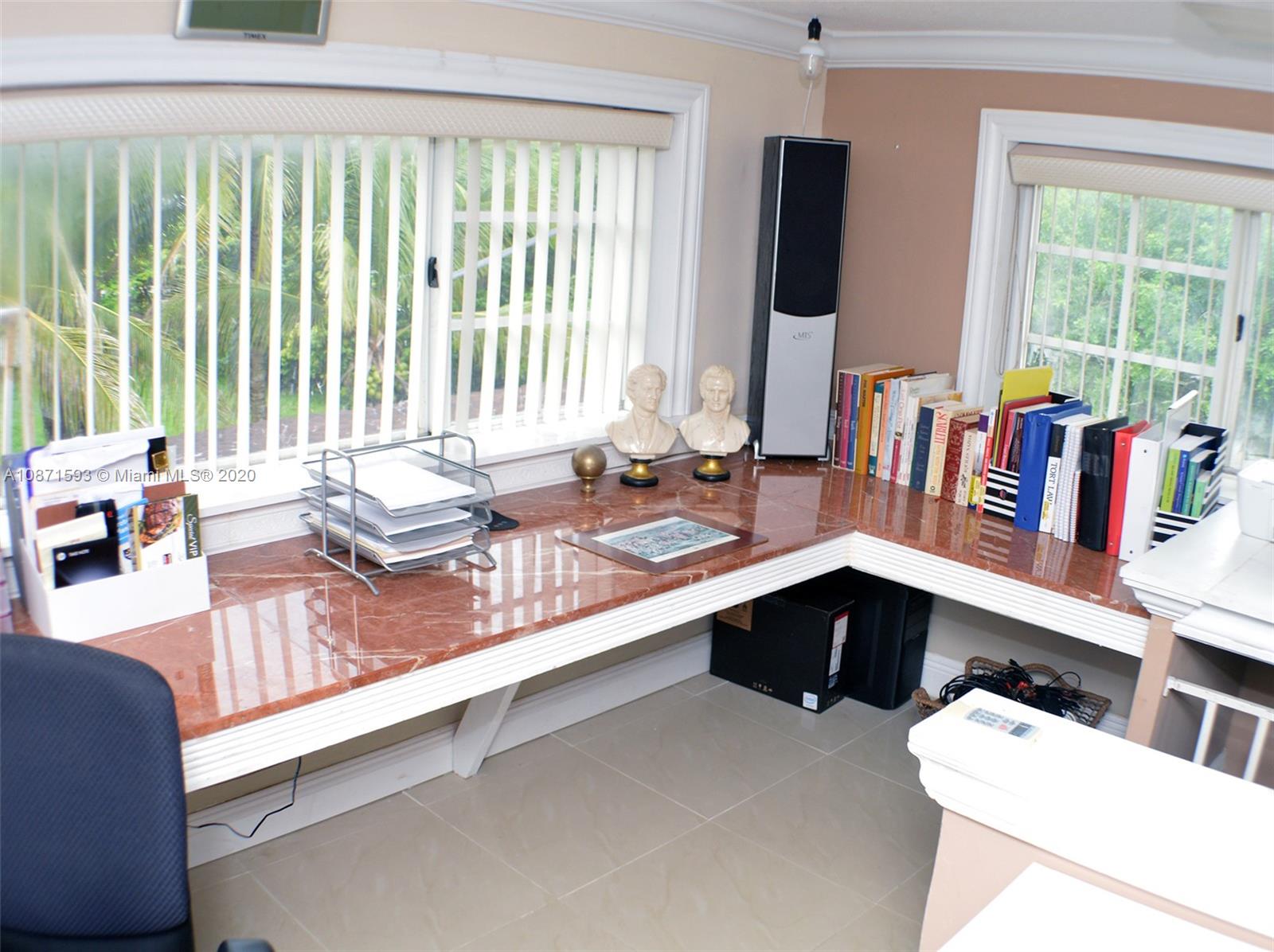 6500 Southwest 148th Avenue Southwest Ranches, FL 33330 - Photo 17 of 25 a kitchen with a large window and cabinets