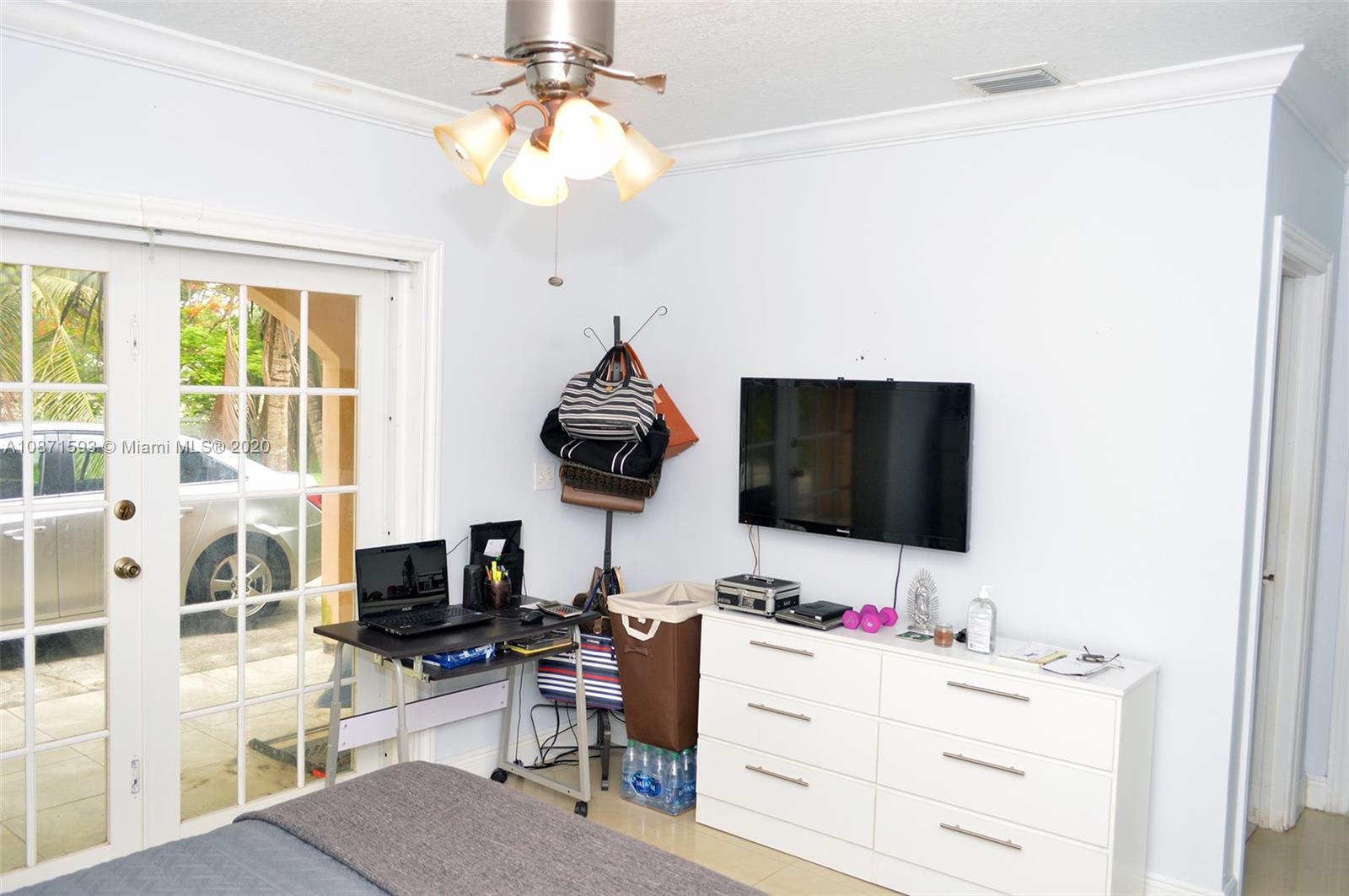 6500 Southwest 148th Avenue Southwest Ranches, FL 33330 - Photo 9 of 25 a living room with furniture and a flat screen tv