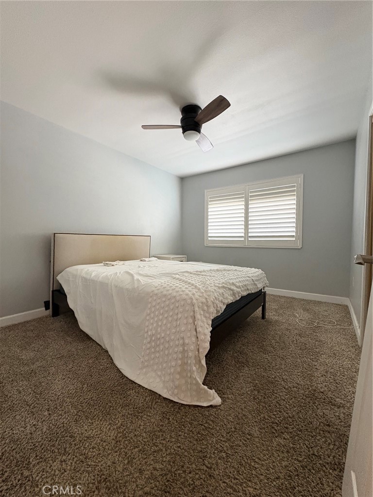 26378 Ridgemoor Road Menifee, CA 92586 - Photo 10 of 20 a bedroom with a bed and window