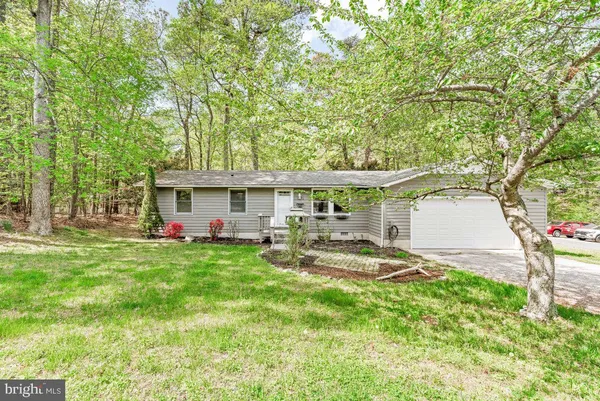 a front view of house with yard and seating area