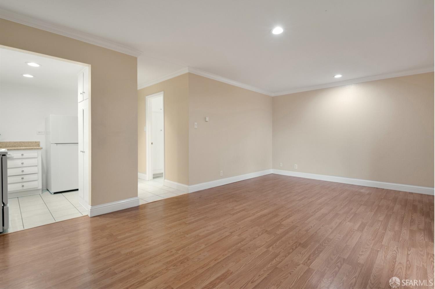 1736 Woodland Avenue Palo Alto, CA 94301 - Photo 5 of 17 wooden floor in an empty room with a window