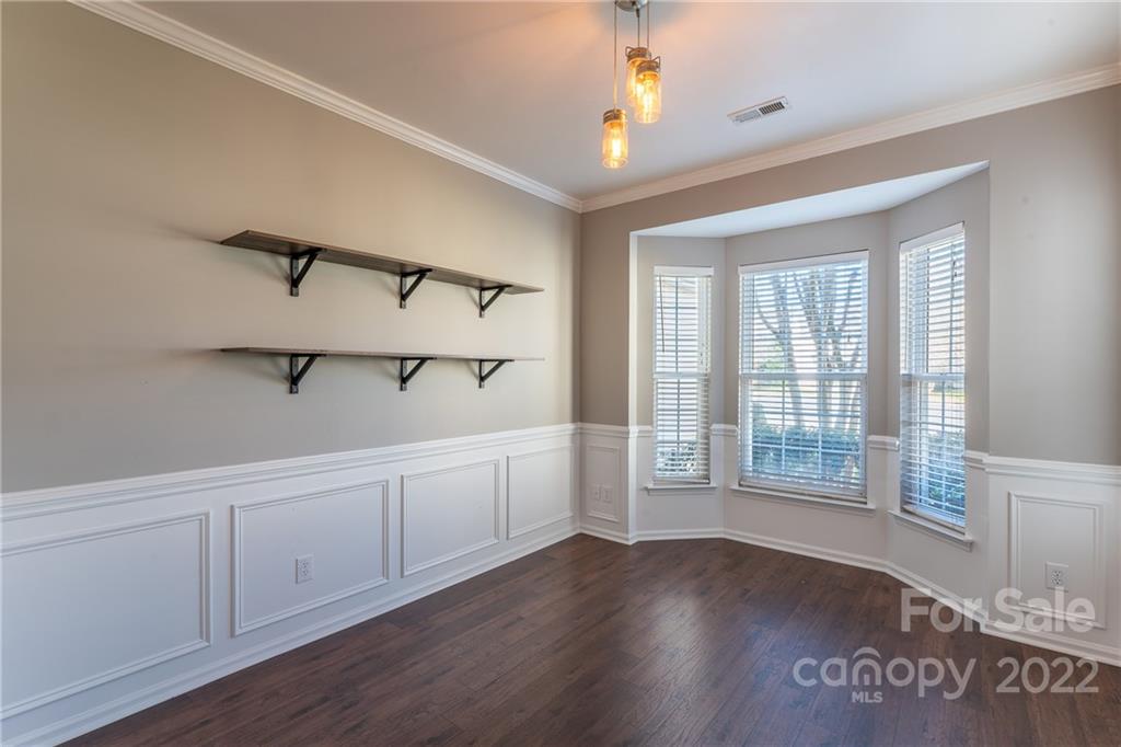 3941 Caliper Place Fort Mill, SC 29708 - Photo 11 of 46 a view of an empty room with wooden floor and fan