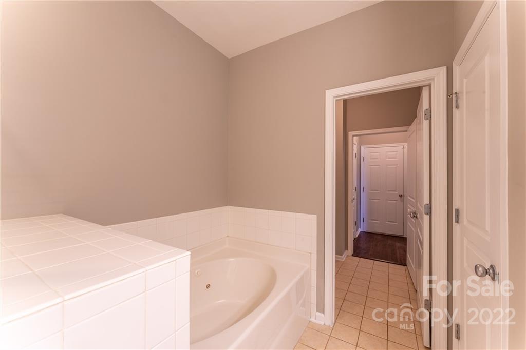3941 Caliper Place Fort Mill, SC 29708 - Photo 21 of 46 a en suite bathroom with a sink and a bath tub