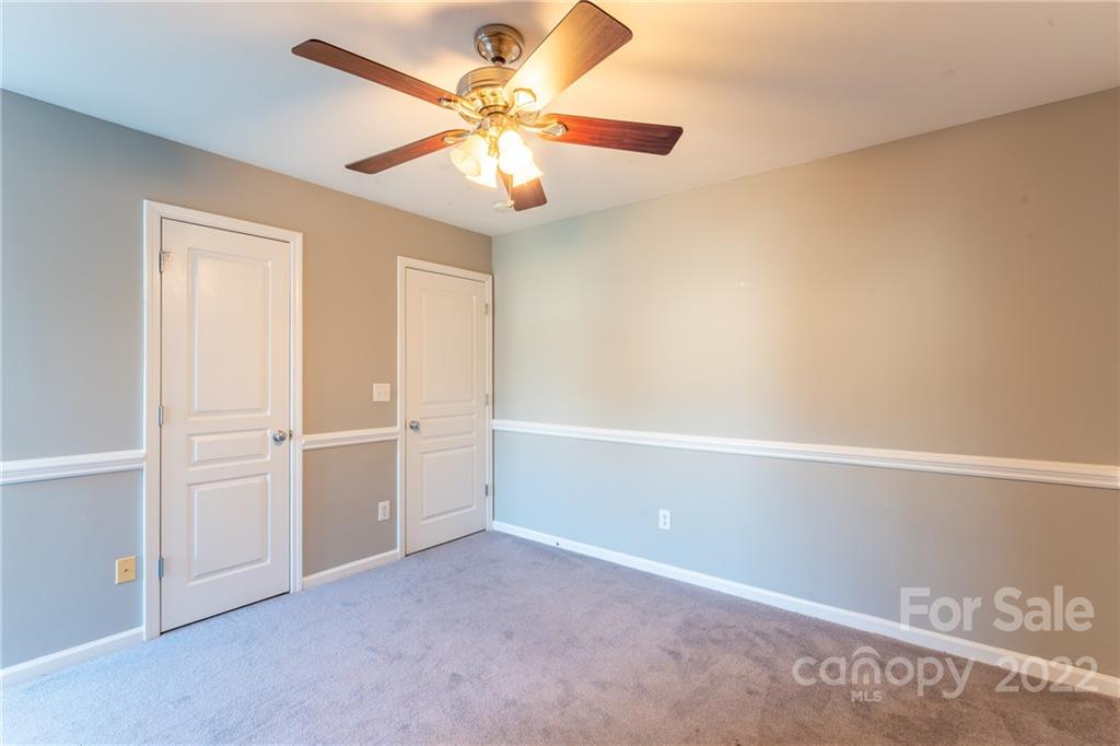 3941 Caliper Place Fort Mill, SC 29708 - Photo 28 of 46 an empty room with windows and fan