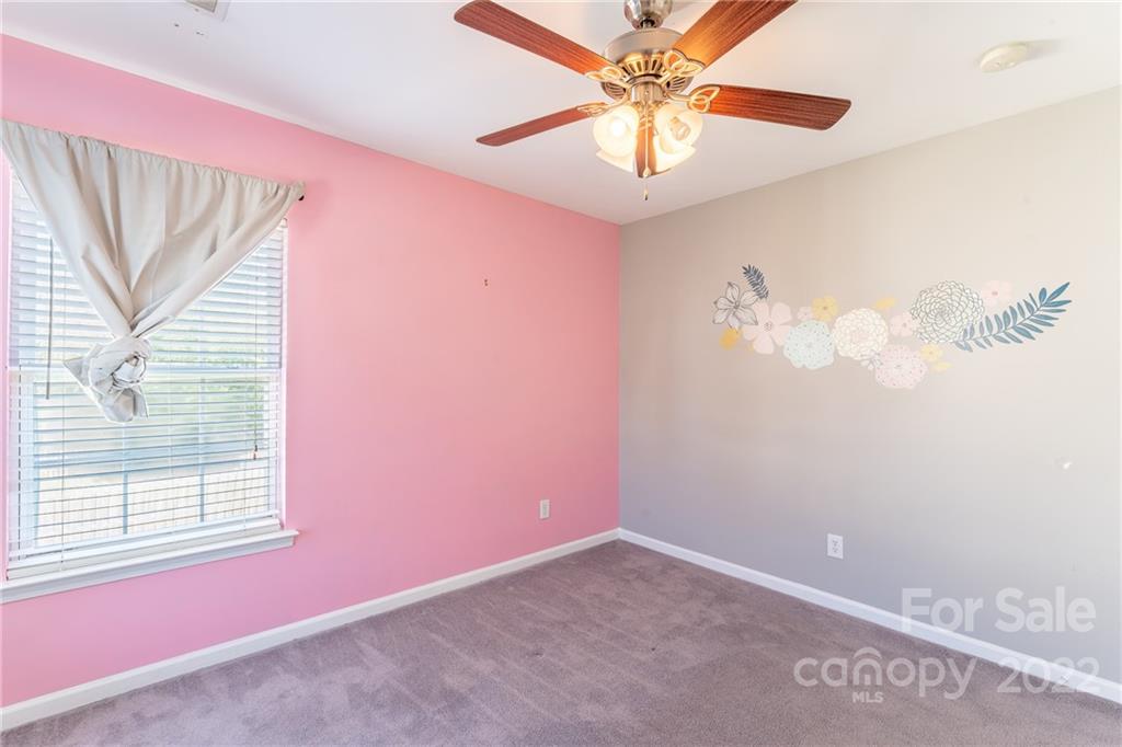 3941 Caliper Place Fort Mill, SC 29708 - Photo 29 of 46 en empty room with windows and fan