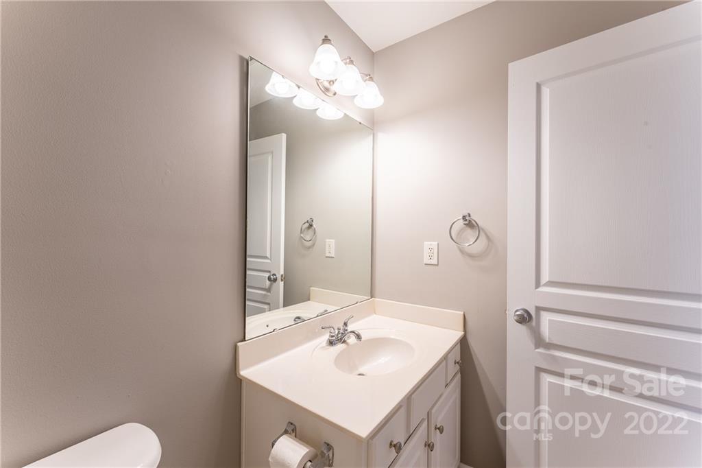 3941 Caliper Place Fort Mill, SC 29708 - Photo 37 of 46 a bathroom with a sink vanity mirror and toilet