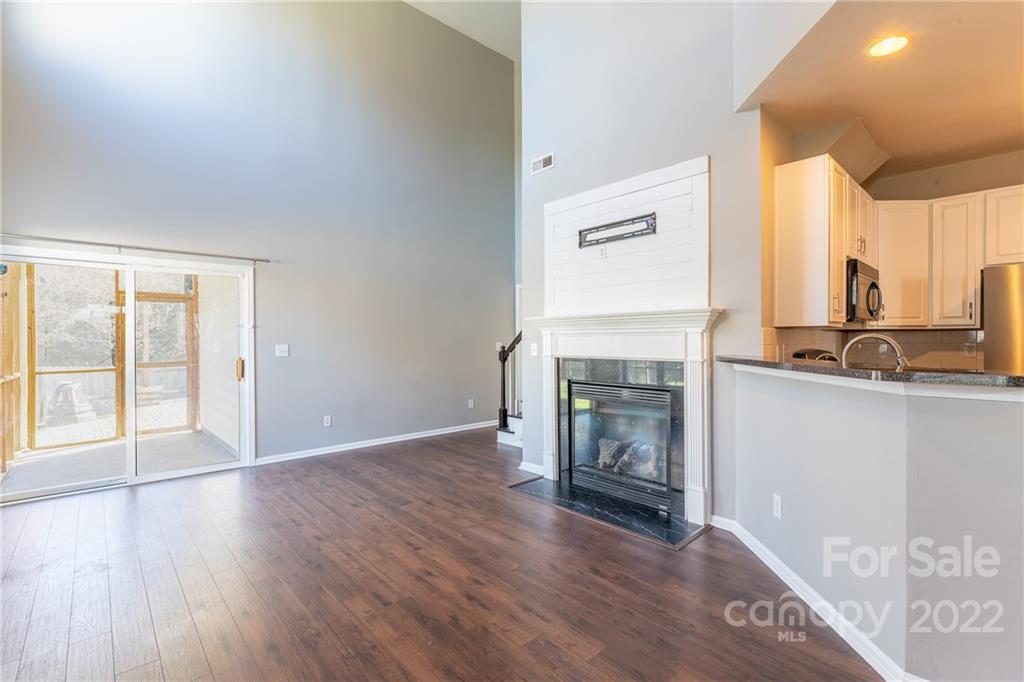 3941 Caliper Place Fort Mill, SC 29708 - Photo 4 of 46 a view of an empty room with a fireplace and a window