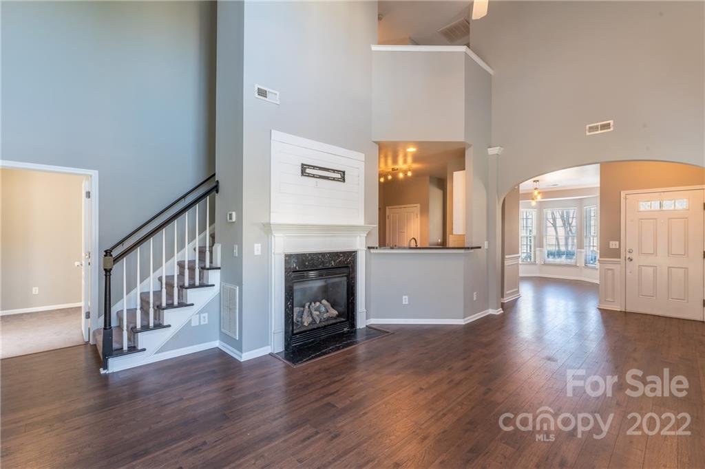 3941 Caliper Place Fort Mill, SC 29708 - Photo 5 of 46 a view of a livingroom with wooden floor and a fireplace