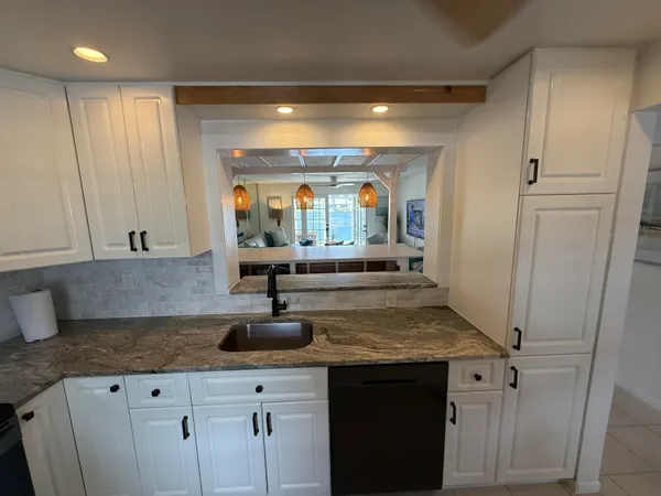 a view of living room with furniture and a flat screen tv