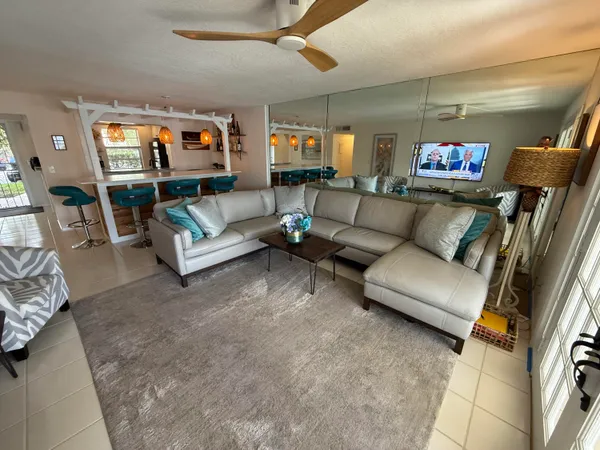 a view of entryway with stairs and a rug