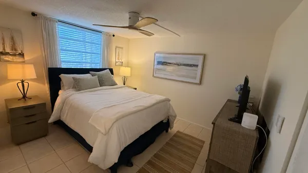 a bathroom with a sink a mirror and a bath tub