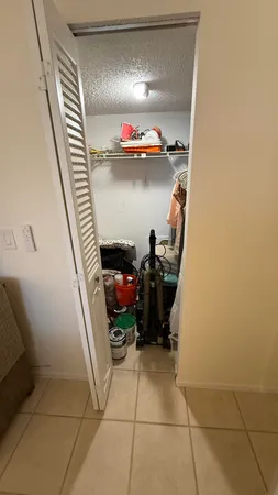 a bedroom with a bed dresser and a window