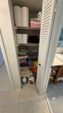 a view of a livingroom with furniture and staircase
