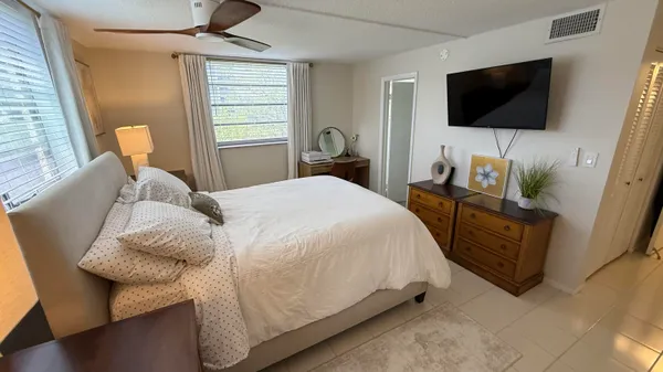 an aerial view of a house with a lake view