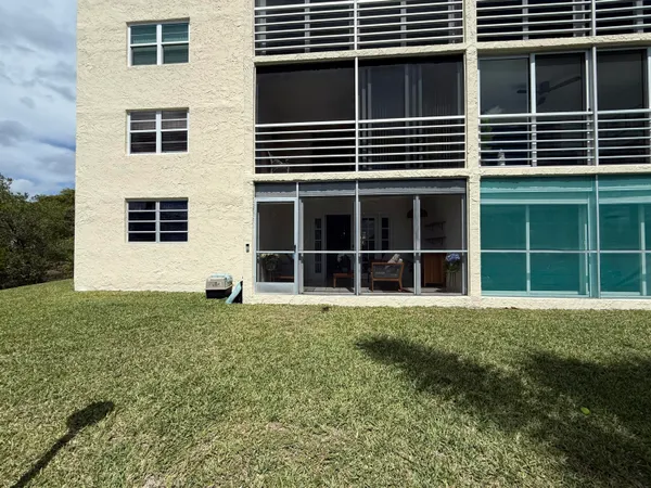 an aerial view of a house with a lake view